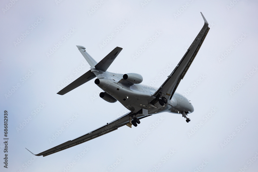 Fototapeta premium Untitled military transport plane at air base. Airport and airfield. Air force and army flight operation. Aviation and aircraft. Air lift. Military industry. Fly and flying.