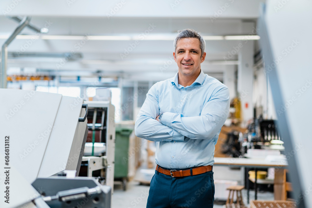 Portrait of a confident businessman in a factory Portrait of a confident businessman in a factory