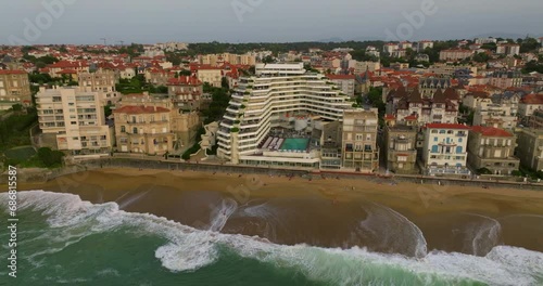 Biarritz large aerial view of the main beach and Biarritz city sunny afternoon France. View of facade of Hotel Sofitel Biarritz Le Miramar Thalassa Sea and Spa on the Miramar beach. photo