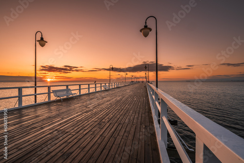 Fototapeta Naklejka Na Ścianę i Meble -  Sunrise on the pier in Orłowo, Gdynia, Tricity
