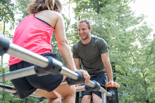 Man and woman exercising on a fitness trail