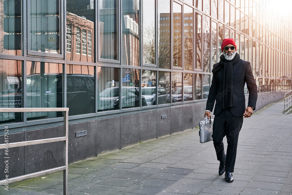 Mature businessman walking in the street