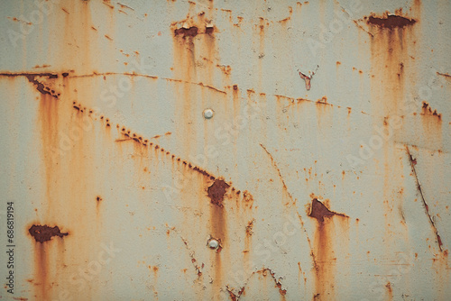 Rusty metal texture background. Old dirty wall background design. Colored texture background cracked paint. Heavy rusted peeled metal texture. Abstract grunge wall texture. © Cristina