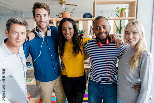 Portrait of confident business team standing in loft office photo