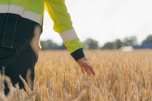 Close-up of man in protective workwear in a field