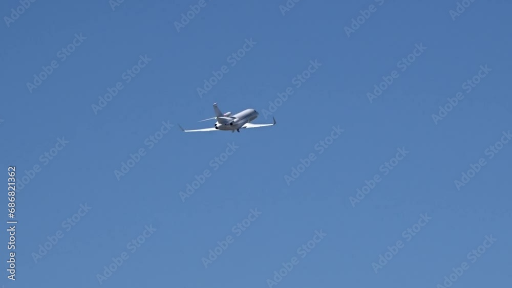 Generic Private Jet Taking Off at Airport against blue sky Generic Private Jet Taking Off at Airport against blue sky