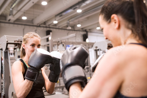 Young women boxing in gym