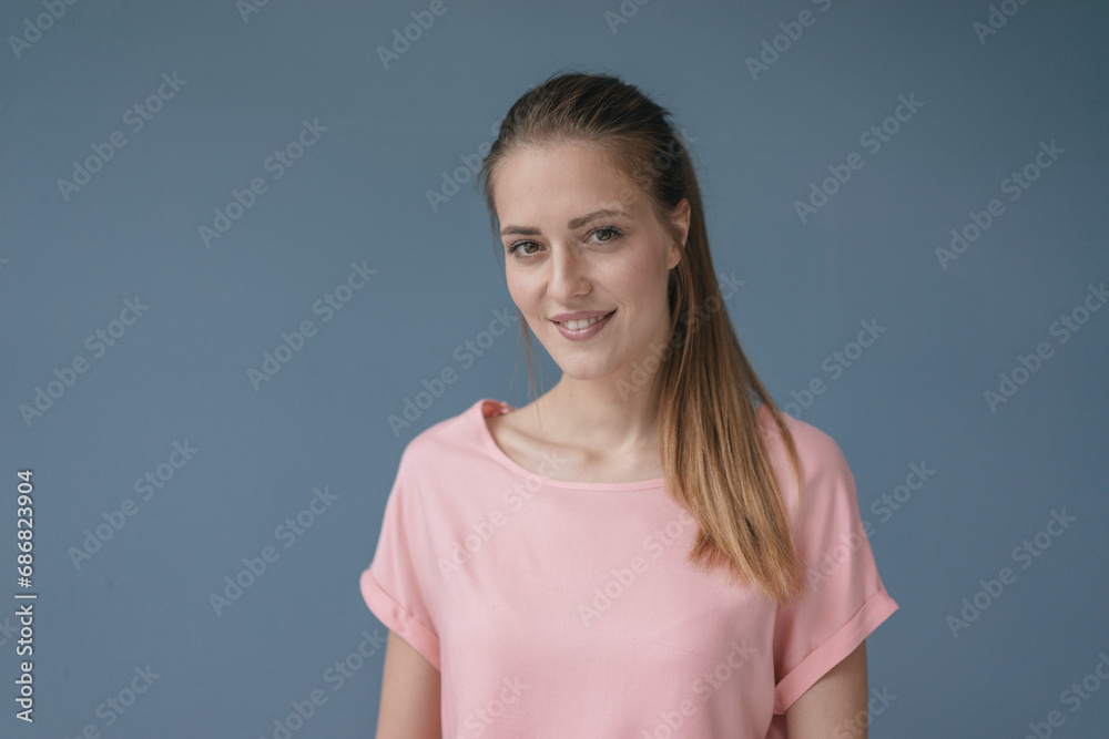 Portrait of a pretty woman, smiling, looking at camera Portrait of a pretty woman, smiling, looking at camera