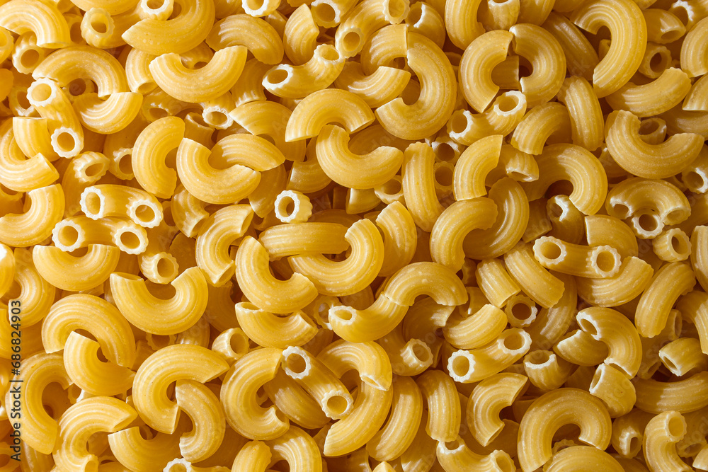 Uncooked Chifferi Rigati Pasta: A Culinary Canvas of Chifferi Rigati, Creating a Lively and Textured Background for Gourmet Cooking. Dry Pasta. Raw Macaroni - Top View, Flat Lay Uncooked Chifferi Rigati Pasta: A Culinary Canvas of Chifferi Rigati, Creating a Lively and Textured Background for Gourmet Cooking. Dry Pasta. Raw Macaroni - Top View, Flat Lay