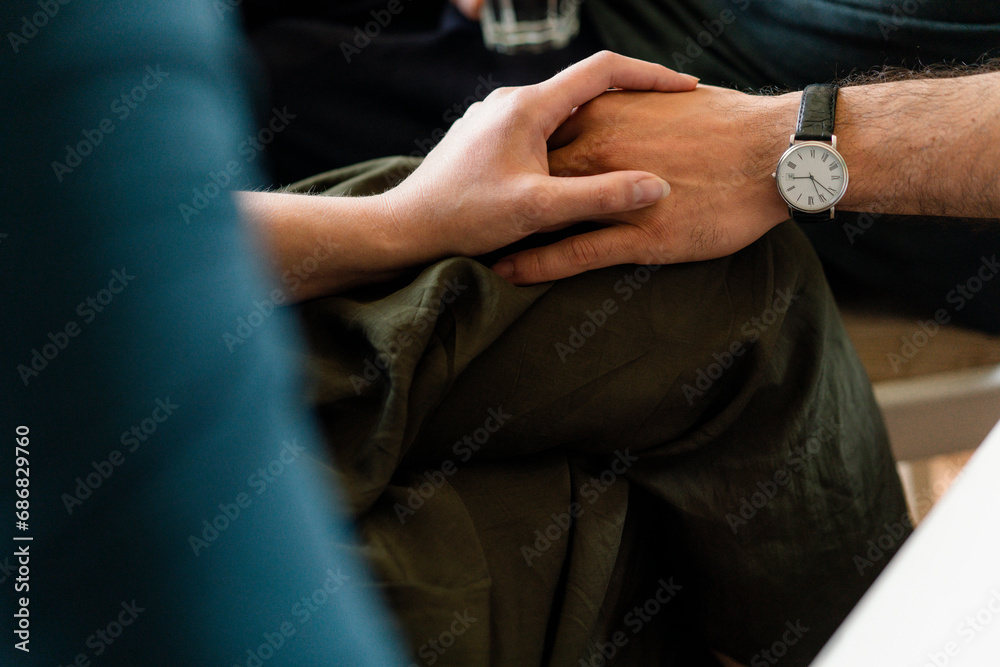 Close-up of couple holding hands