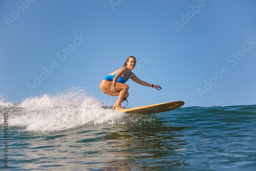 Indonesia, Bali, Batubolong beach, Pregnant woman, surfer in ocean
