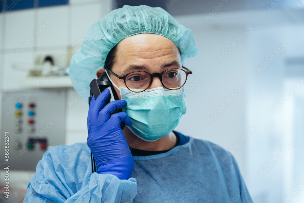 Portrait of a doctor on the phone in a hospital Portrait of a doctor on the phone in a hospital