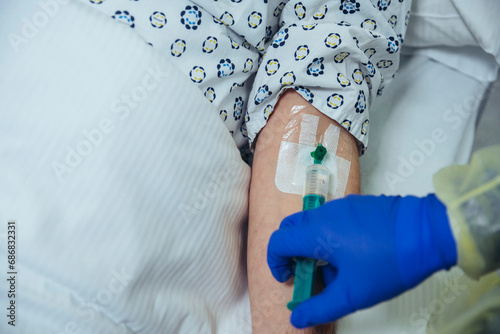 Close-up of patient in hospital receiving an infusion © tunedin