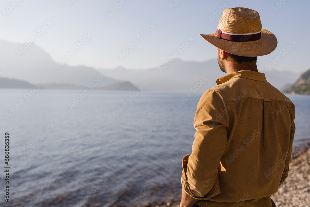 Italy, Lierna, back view of man looking at lake