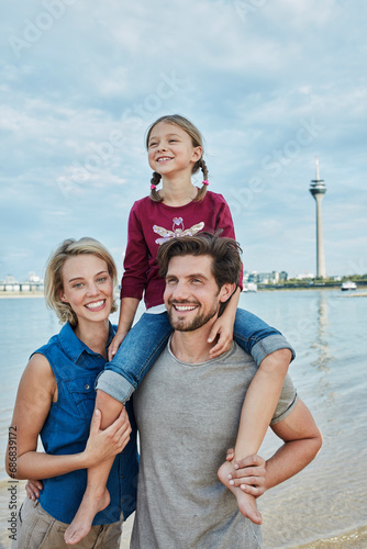 Germany, Duesseldorf, happy family with daughter at Rhine riverbank © tunedin