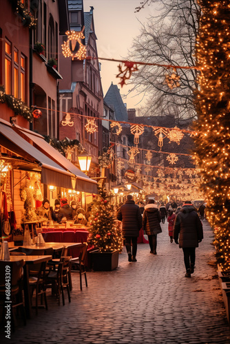 People in Christmas market, an illuminated street. Festive new year lights.