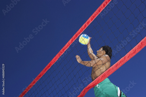 Man Playing Beach Volleyball photo
