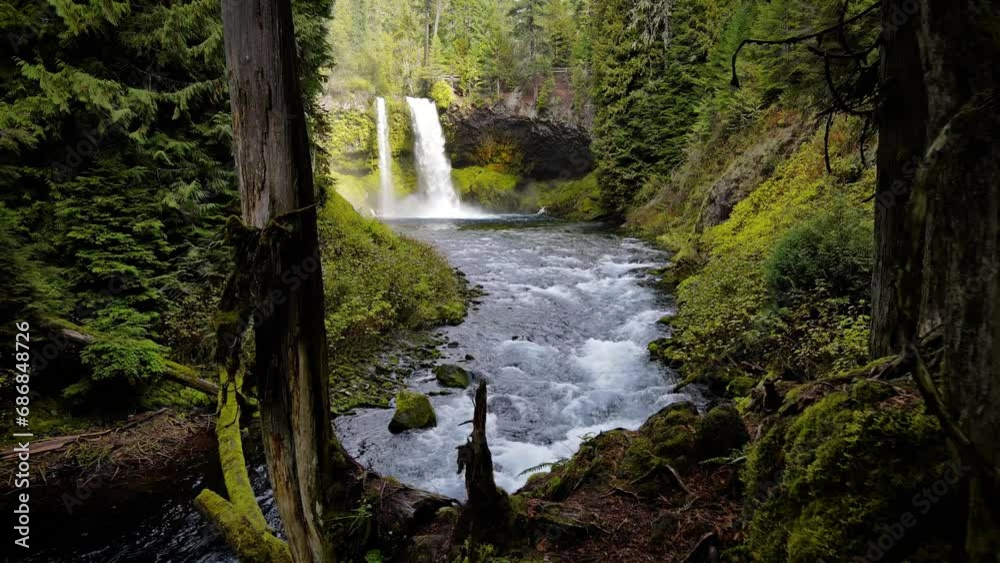 Aerial shot of the amazing Koosah Falls and lush moss covered forest on the McKenzie River in Oregon. Aerial shot of the amazing Koosah Falls and lush moss covered forest on the McKenzie River in Oregon.