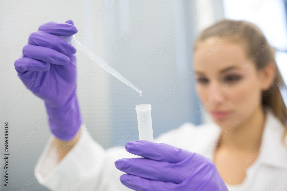 Lab technician pipetting Lab technician pipetting
