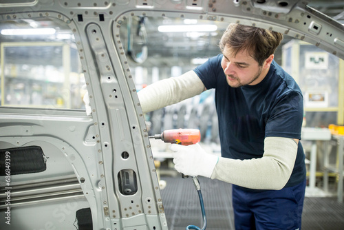 Man working in modern car factory