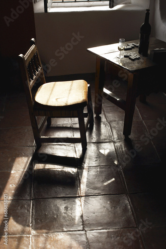 Chair, Bottle and Dominoes in Room photo