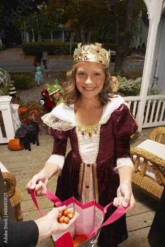 Portrait of Girl Trick or Treating at Halloween photo