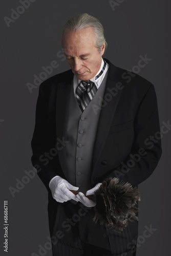 Butler with Feather Duster photo