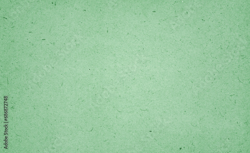 Recycled green paper background and texture. Craft eco textured paper sheet background beige color for cards and other design ideas beige color.White paper texture with particles. Paper background