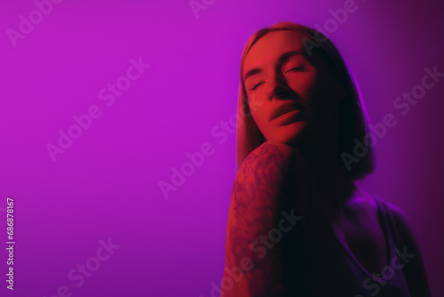 A serene portrait of a woman with eyes closed, enveloped in a soft violet light, exuding peace