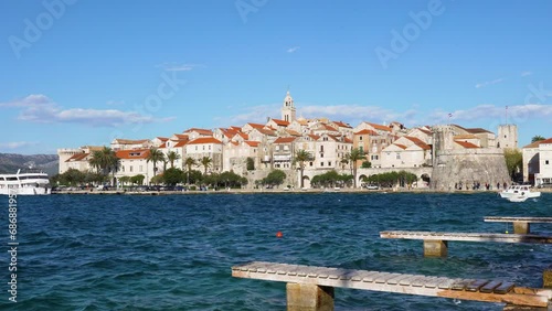 Historic town of Korcula on a windy day. View of stone walls, towers, churchs and old houses.