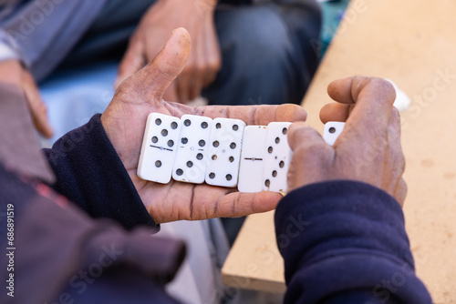 Men playing dominoes in the ancient Berber town of Ksar Ouled Soltane.