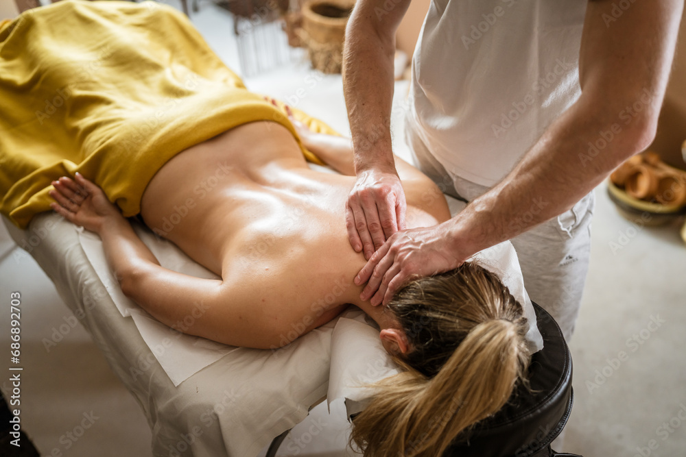 unknown woman enjoy neck massage at beauty spa male therapist unknown woman enjoy neck massage at beauty spa male therapist