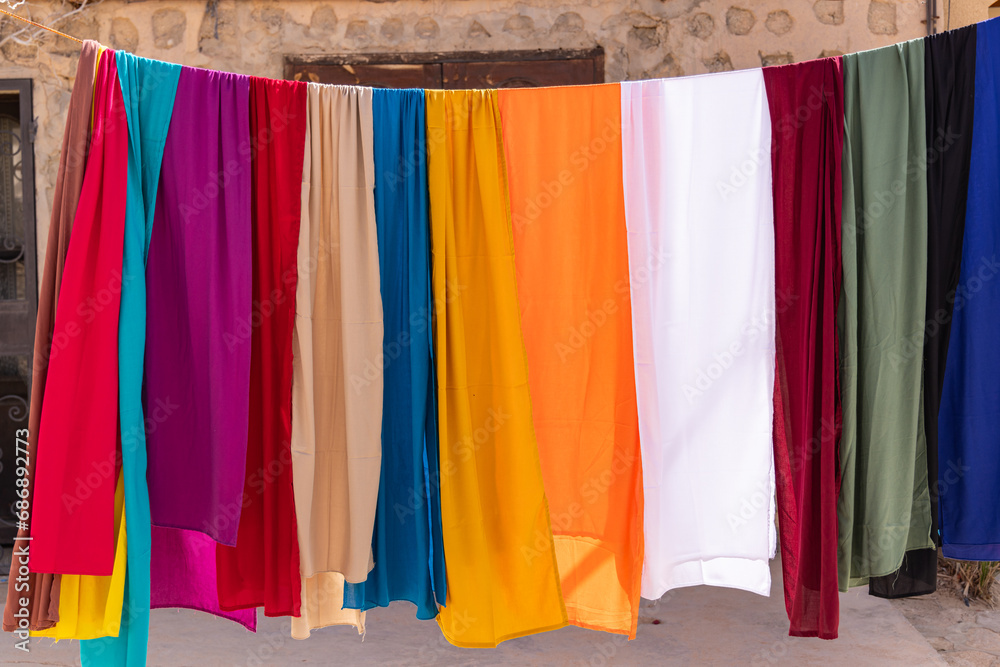 Colorful cloth for sale at a market in Shabikah.