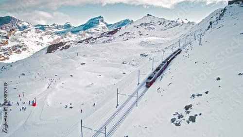 Cog railway train ride to the Gornergrat Observation Platform in Zermatt. Observation deck in Zermatt, Switzerland during snow in winter time. photo