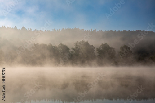 A foggy morning at the lake in the forest. Landscape. © bluejeansw