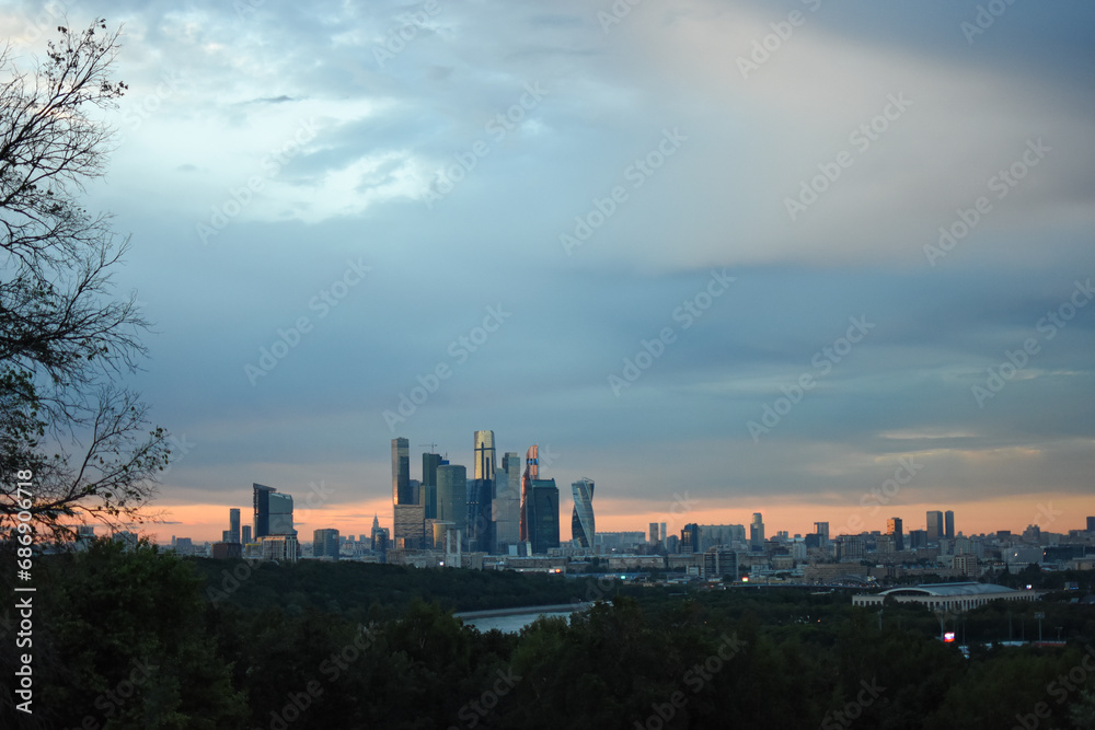 Moscow Skyscapes: Sunset Over Urban Greenery
