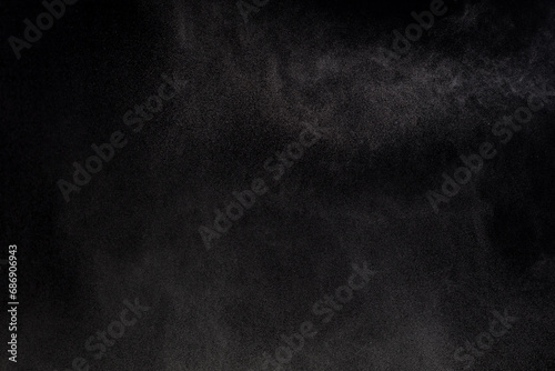 Million of Star Dust, Photo image of falling down shower rain snow, heavy snows storm flying. Freeze shot on black background isolated overlay. Spray water fog smoke as star particle on wind photo