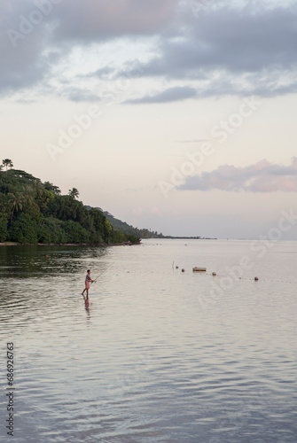 Fishing in Tahiti on the beach at sunset
