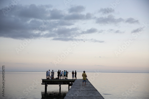 Sunset on the pier on a dock over the ocean