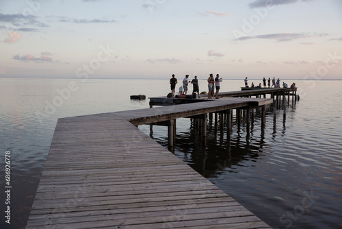Sunset on the pier on a dock over the ocean