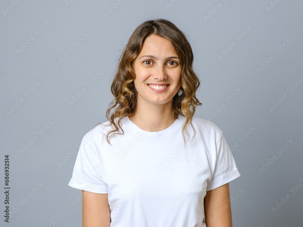 Happy successful woman in casual outfit smiling at camera and looking confident Happy successful woman in casual outfit smiling at camera and looking confident