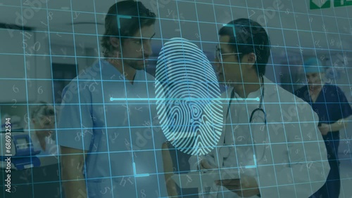Animation of data processing with fingerprint over diverse male doctors in hospital photo