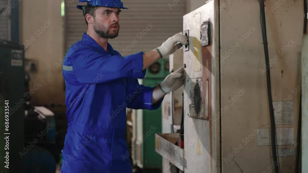 Technician inspecting main switch board in factory
Technician inspecting main switch board in factory