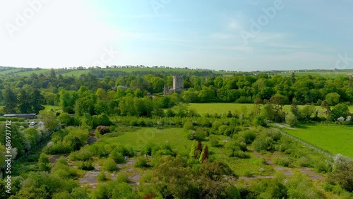 Blarney Castle, medieval stronghold in Blarney, known for its legendary world-famous magical Blarney Stone aka Stone of Eloquence, and awe Blarney Gardens. County Cork, Ireland. Speed ramp effect. photo