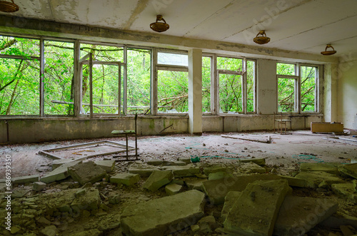 Premises of abandoned school in resettled village of Pogonnoe in exclusion zone of Chernobyl nuclear power plant, Belarus photo