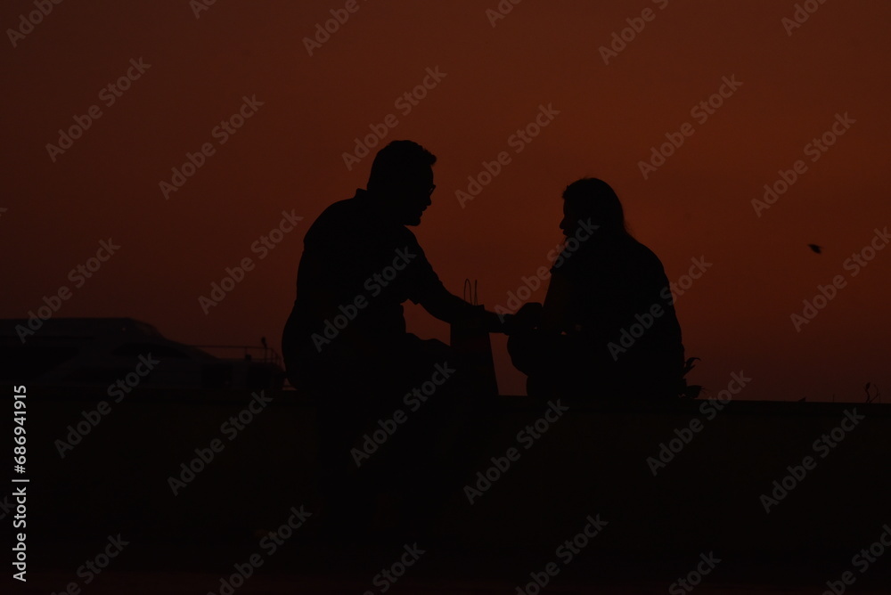 silhouette of family on the beach