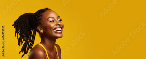 Portrait of a young smiling black woman. Skin care beauty, skincare cosmetics, dental concept, isolated over yellow background.