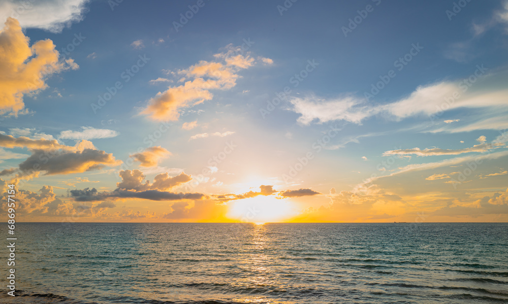 Sunrise sea on tropical beach. Landscape of beautiful beach. Beautiful sunset at sea. Colorful ocean beach sunrise with deep blue sky and sunrays. Caribbean sea.