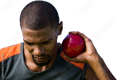 Digital png photo of focused african american sportsman holding ball on transparent background