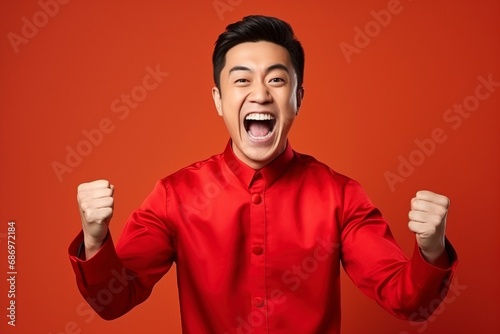 Photo happy chinese new year. handsome asian man gesture of congratulation, one color background, copy space, generative ai